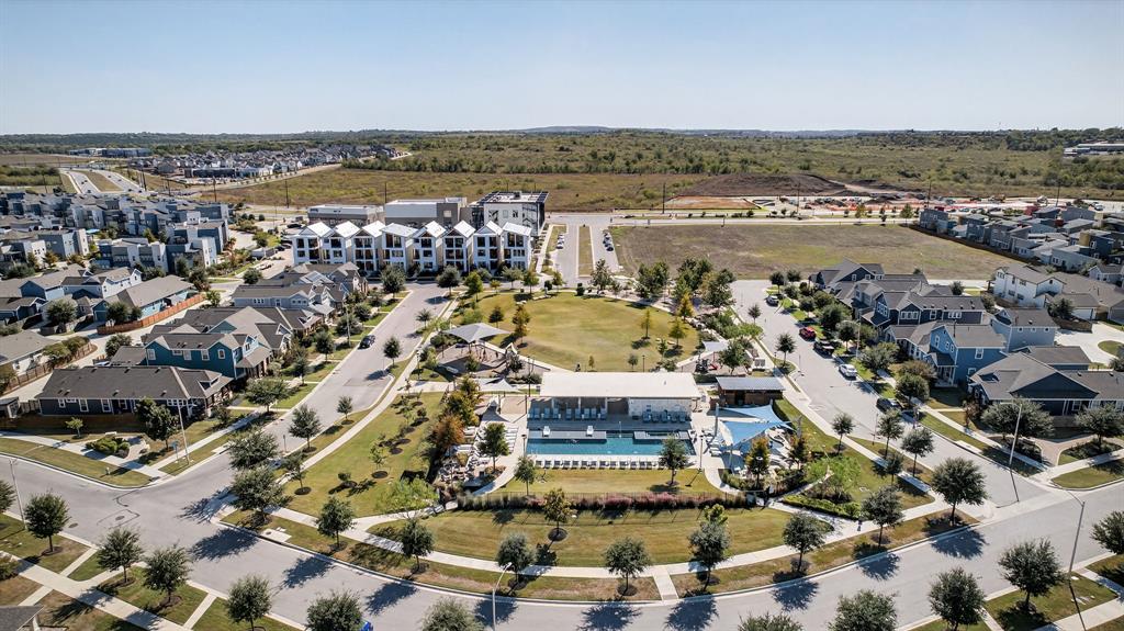 5804 Rotunda View Austin, TX 78747 - Photo 26 of 27 An aerial perspective showcases a vibrant residential community, complete with a central park and sparkling pool.