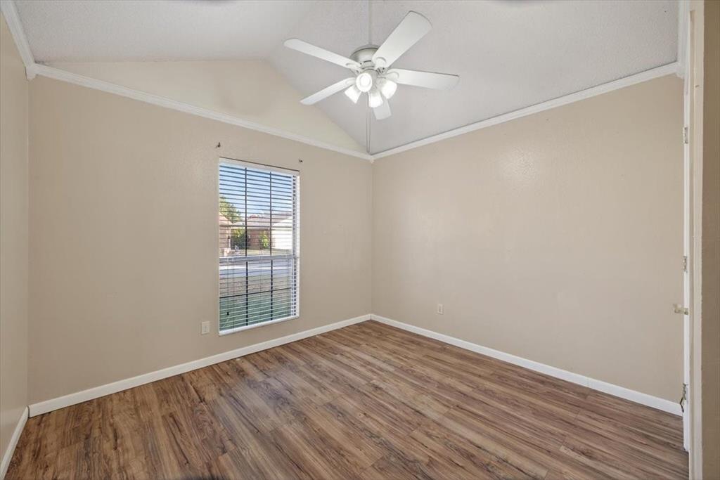 920 Danforth Place Arlington, TX 76017 - Photo 13 of 28 wooden floor in an empty room with a window