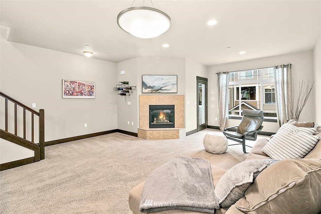 3808 Northeast 3rd Place Renton, WA 98056 - Photo 11 of 34 a view of a livingroom with furniture and a fireplace