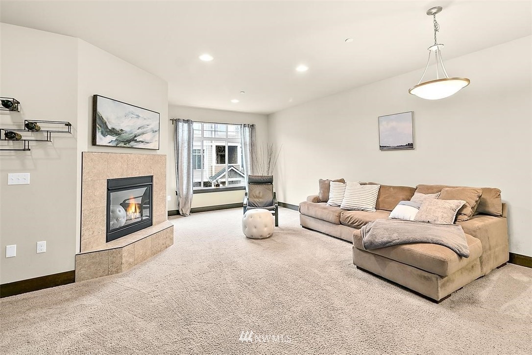3808 Northeast 3rd Place Renton, WA 98056 - Photo 12 of 34 a living room with furniture and a fireplace