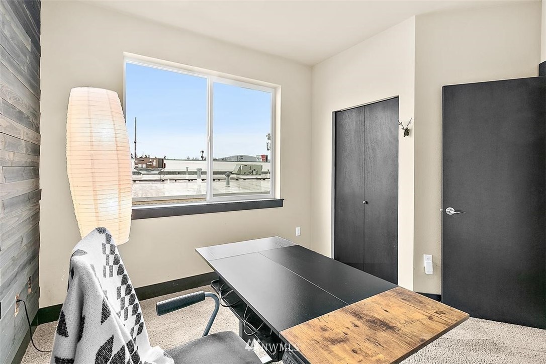 3808 Northeast 3rd Place Renton, WA 98056 - Photo 16 of 34 a view of a workspace with furniture and a window