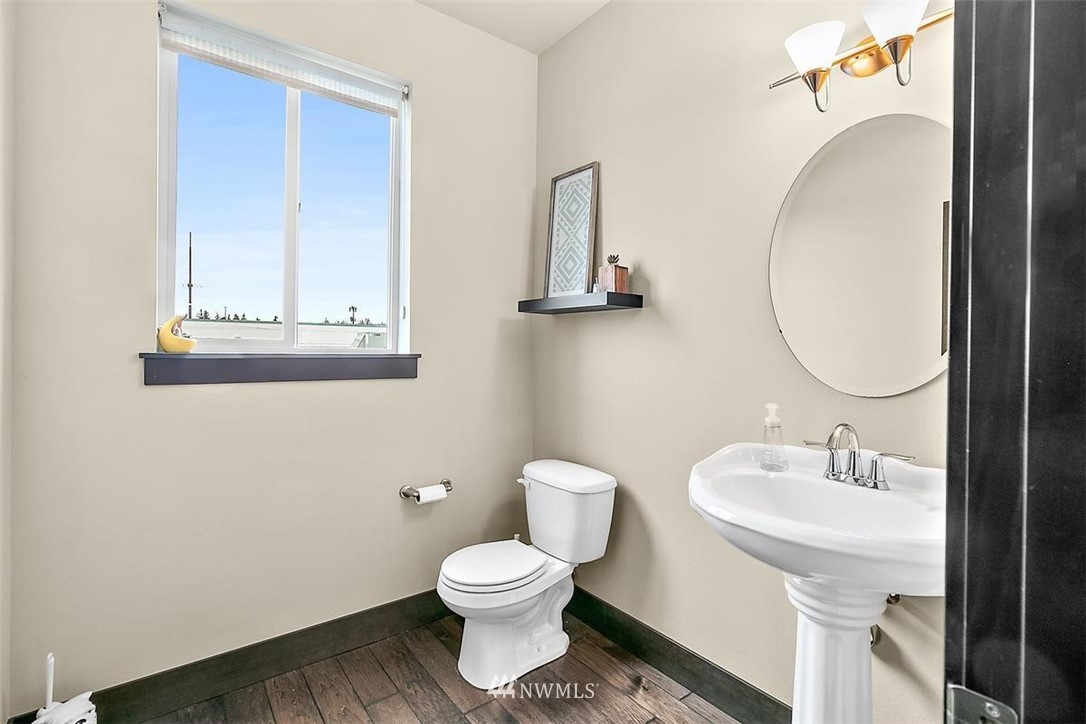 3808 Northeast 3rd Place Renton, WA 98056 - Photo 17 of 34 a bathroom with a toilet sink and mirror
