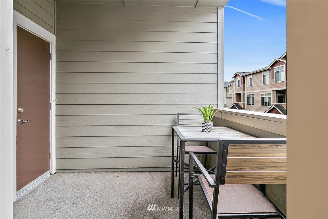 3808 Northeast 3rd Place Renton, WA 98056 - Photo 18 of 34 a view of a patio with table and chairs