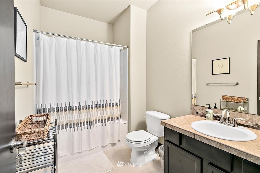 3808 Northeast 3rd Place Renton, WA 98056 - Photo 21 of 34 a bathroom with a sink toilet and shower
