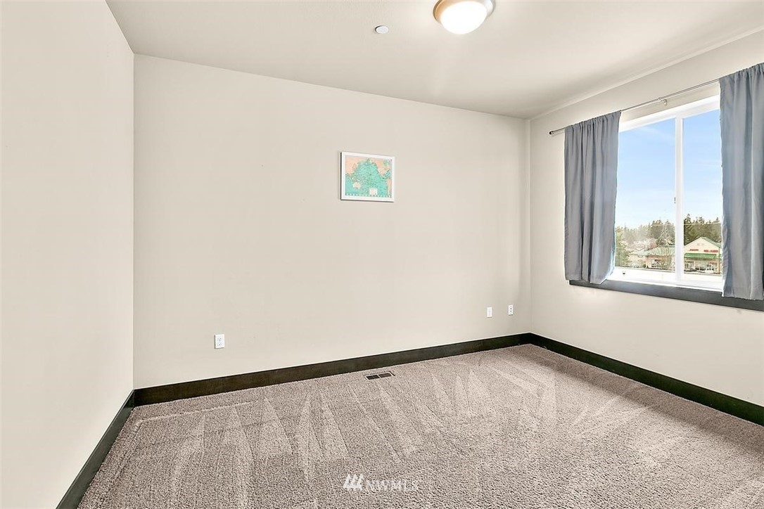3808 Northeast 3rd Place Renton, WA 98056 - Photo 22 of 34 a view of an empty room with a window