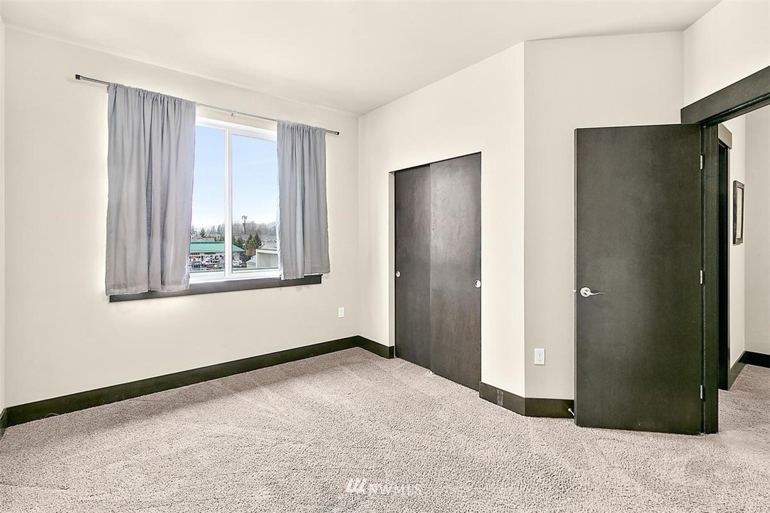3808 Northeast 3rd Place Renton, WA 98056 - Photo 23 of 34 a view of an empty room with window and closet area