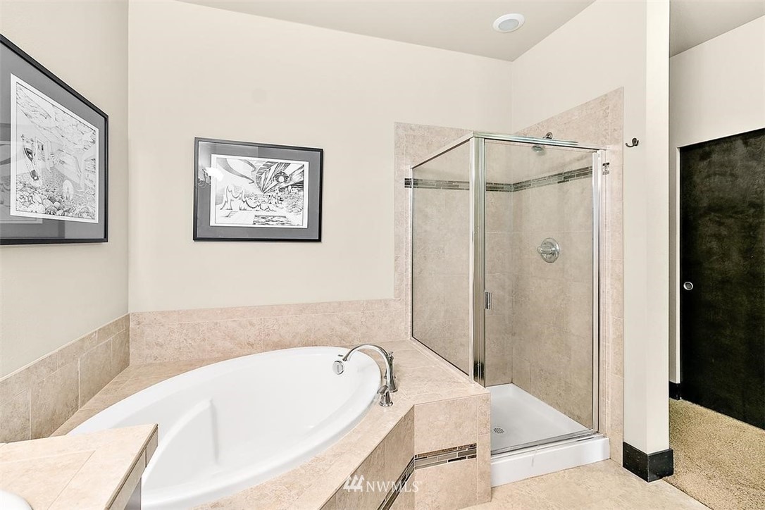 3808 Northeast 3rd Place Renton, WA 98056 - Photo 26 of 34 a bathroom with a tub and shower