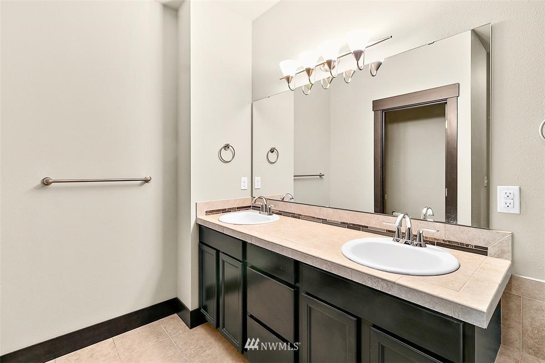 3808 Northeast 3rd Place Renton, WA 98056 - Photo 27 of 34 a bathroom with a sink and a mirror