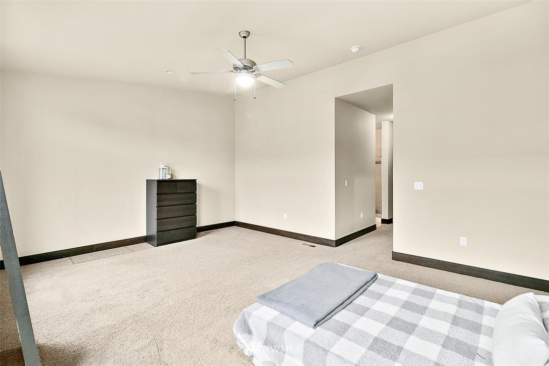 3808 Northeast 3rd Place Renton, WA 98056 - Photo 30 of 34 a view of an empty room with a chandelier fan