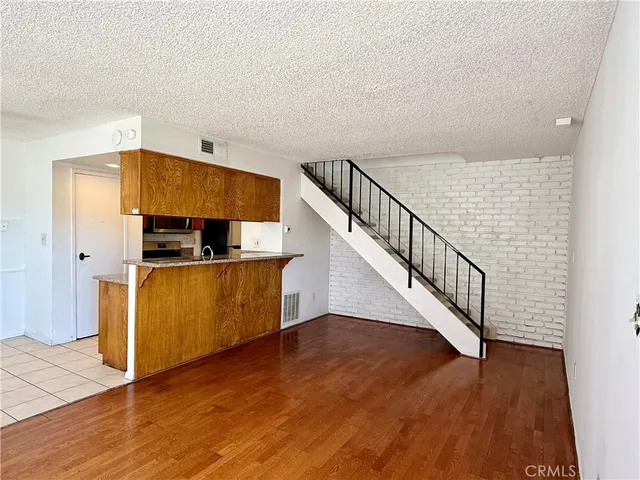 a view of kitchen and wooden floor