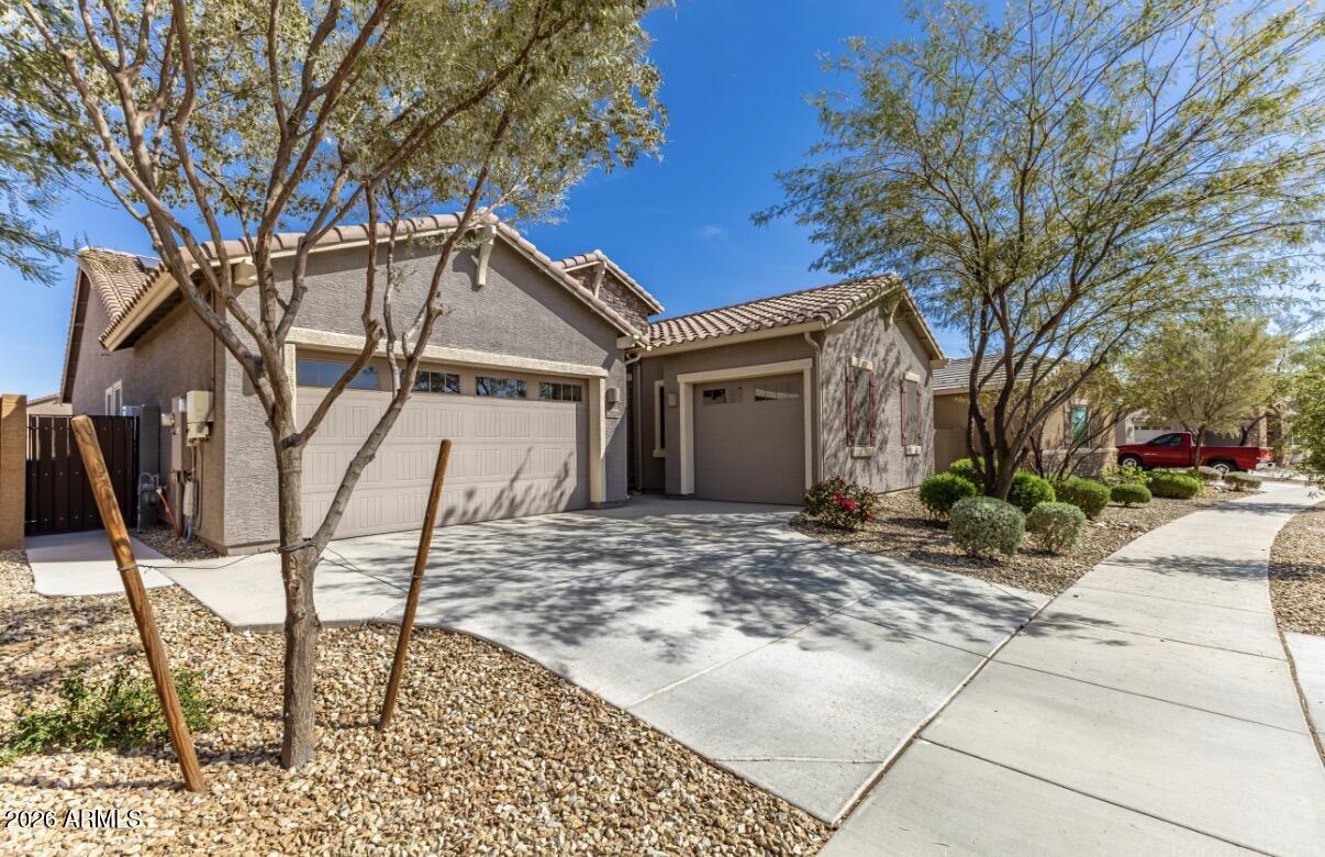 23929 North 166th Lane Surprise, AZ 85387 - Photo 2 of 23 a view of a house with snow on the wall