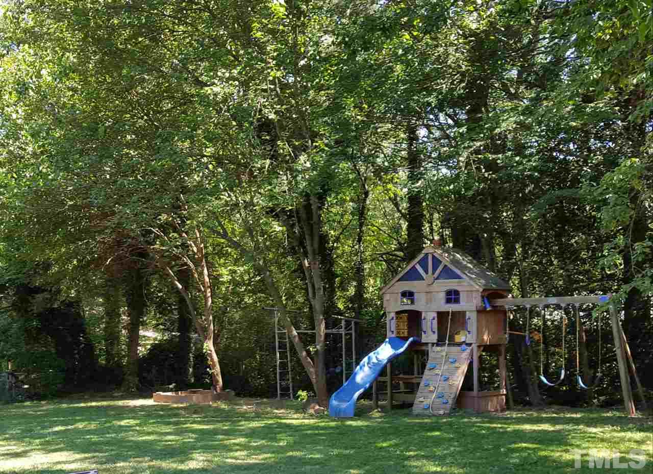 400 Compton Road Raleigh, NC 27609 - Photo 2 of 25 a front view of a house with garden