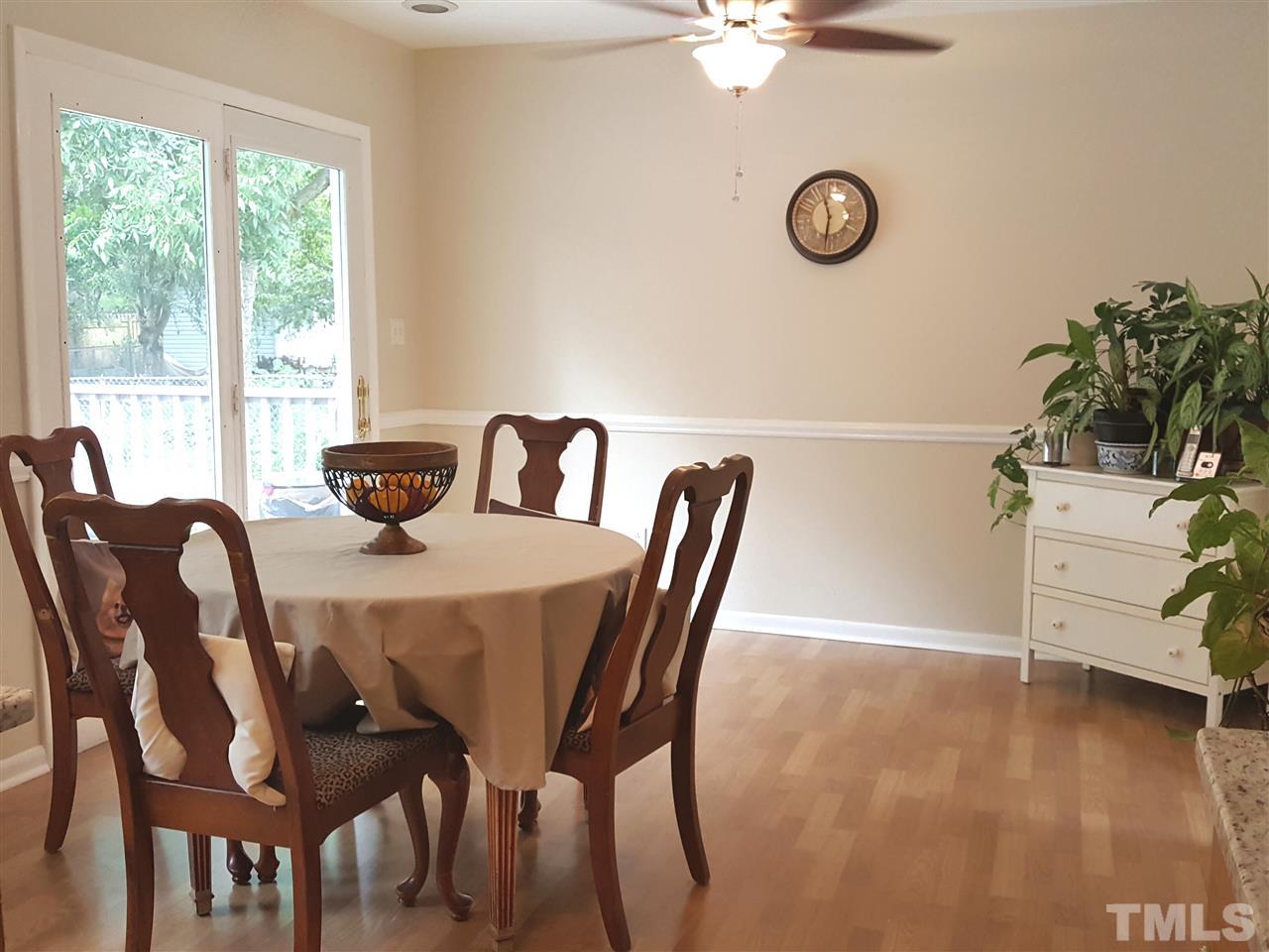 400 Compton Road Raleigh, NC 27609 - Photo 9 of 25 a view of a dining room with furniture and wooden floor