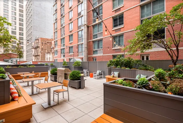 a room with pool table and wooden floor