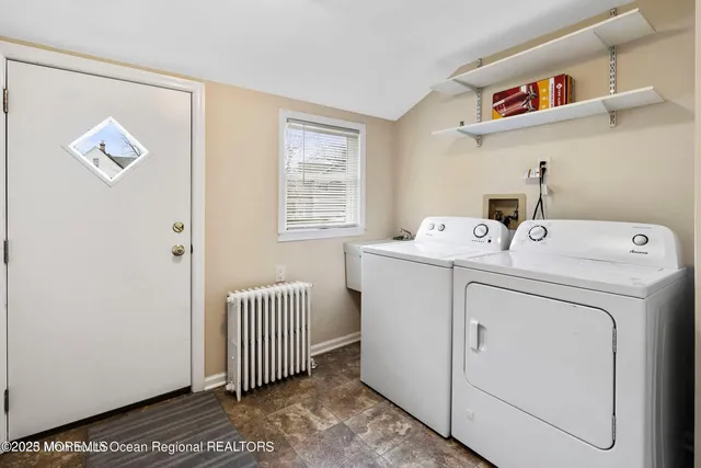 a utility room with dryer and washer