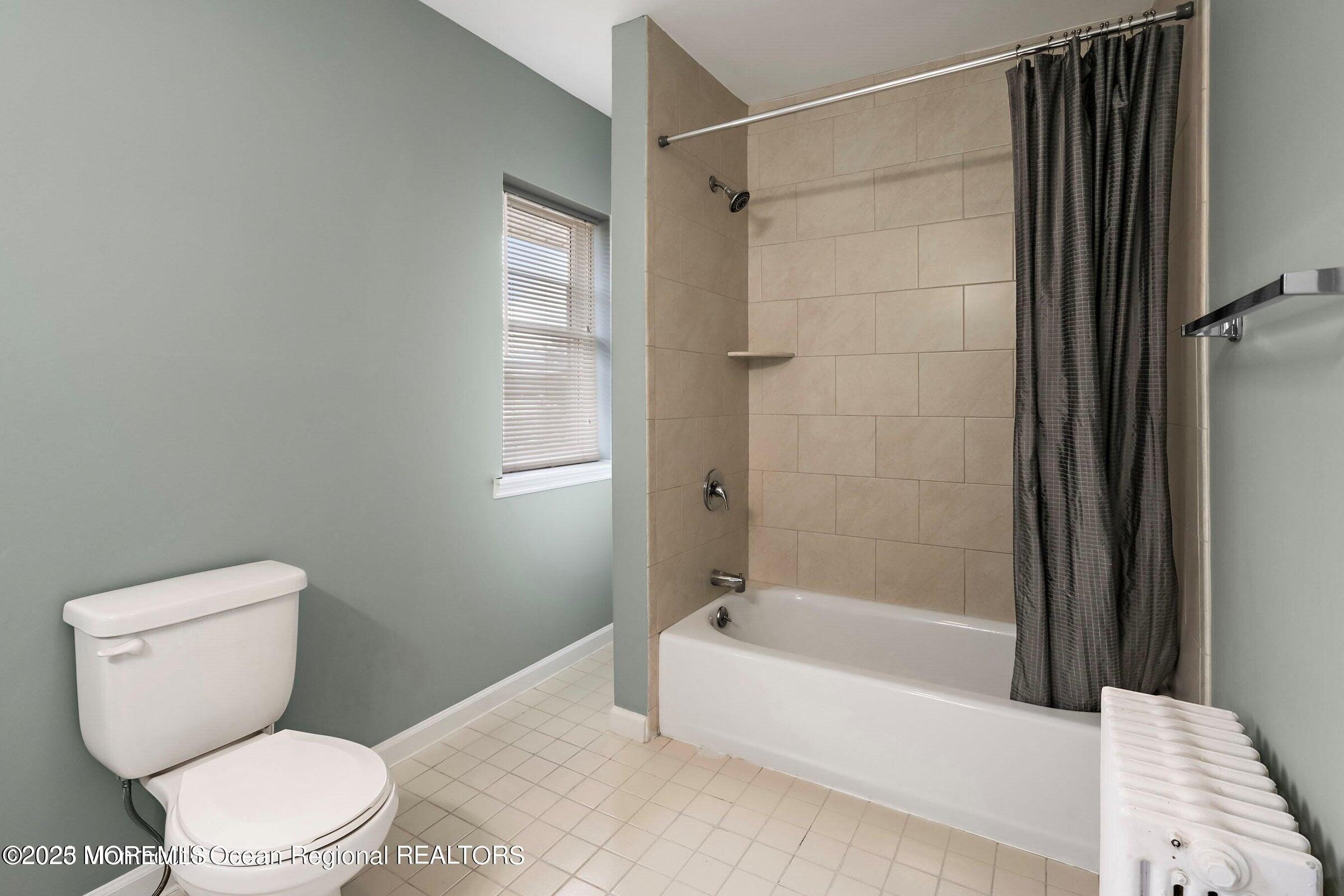 34 Bridge Avenue, Unit A Red Bank, NJ 07701 - Photo 19 of 27 a bathroom with a toilet and a bathtub