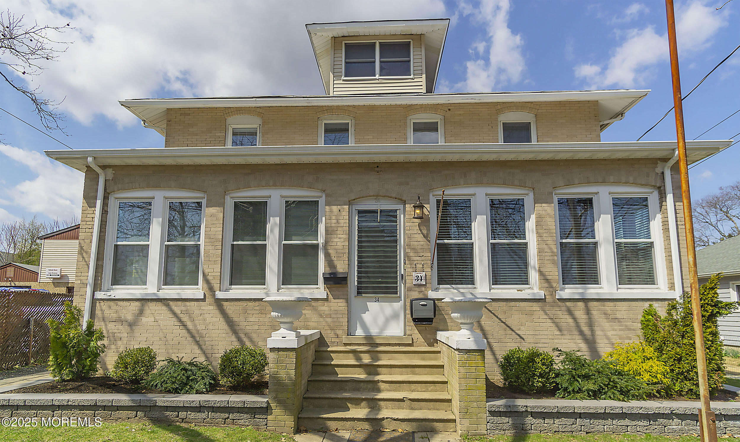 34 Bridge Avenue, Unit A Red Bank, NJ 07701 - Photo 2 of 27 a front view of a house with a yard