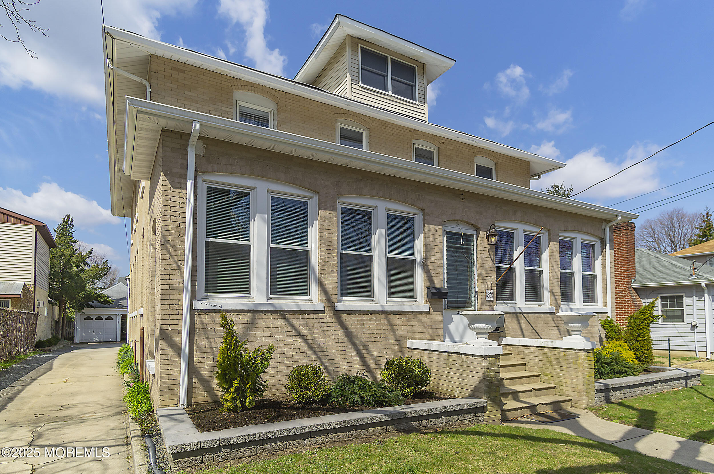 34 Bridge Avenue, Unit A Red Bank, NJ 07701 - Photo 3 of 27 a front view of a house with a yard