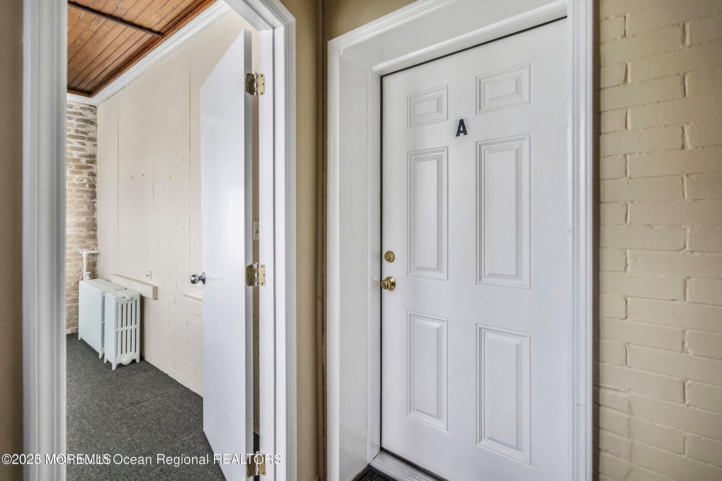 34 Bridge Avenue, Unit A Red Bank, NJ 07701 - Photo 4 of 27 a view of a bathroom with white door