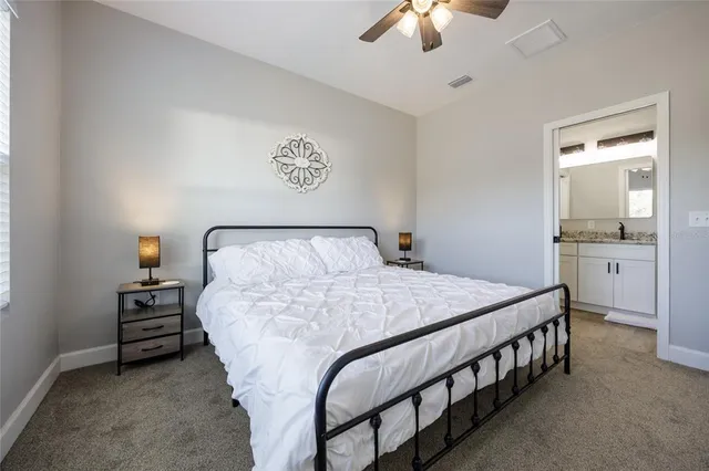 a view of a big room with closet and chandelier fan