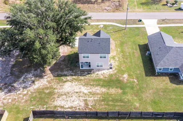 a front view of a house with outdoor seating