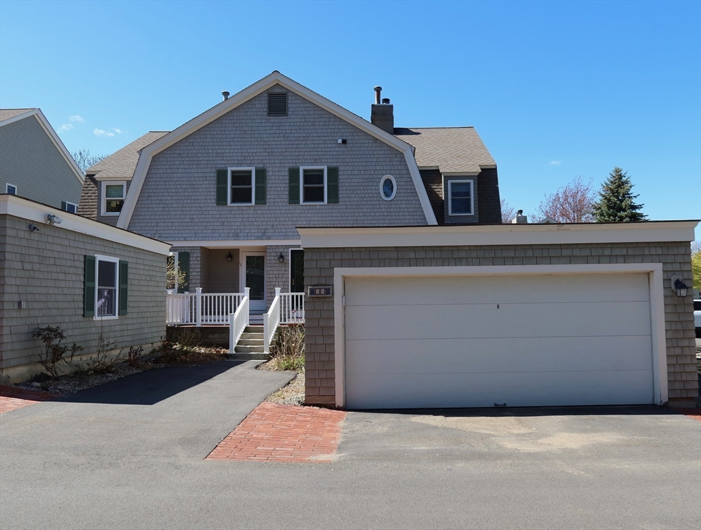 74 Branch Street, Unit 15 Scituate, MA 02066 - Photo 4 of 26 a front view of a house with a yard