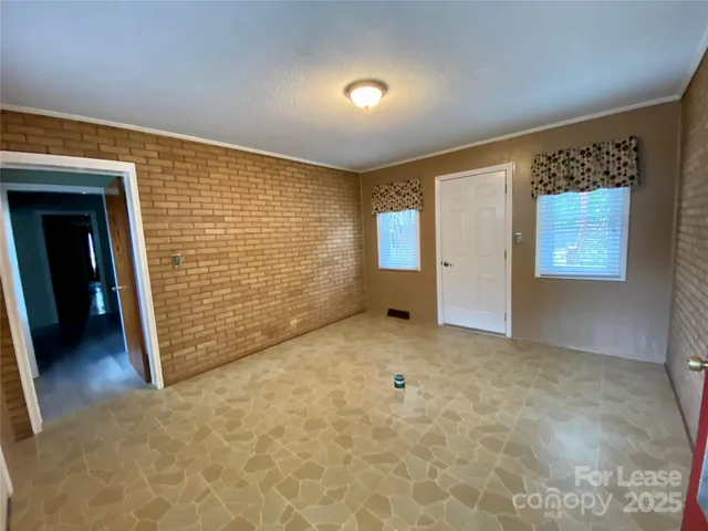 a view of an empty room and window