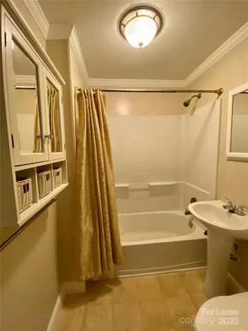 a bathroom with a tub and a shower
