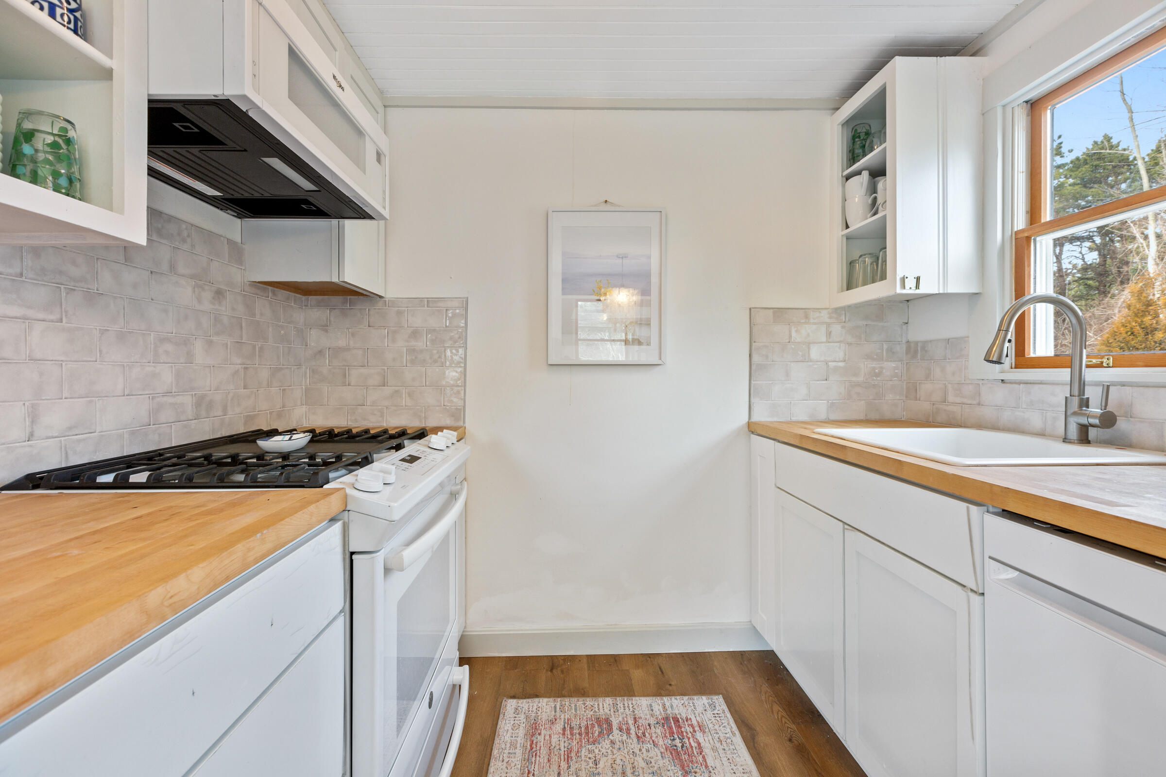 4 Perry Road Truro, MA 02666 - Photo 11 of 29 a kitchen with sink and cabinets