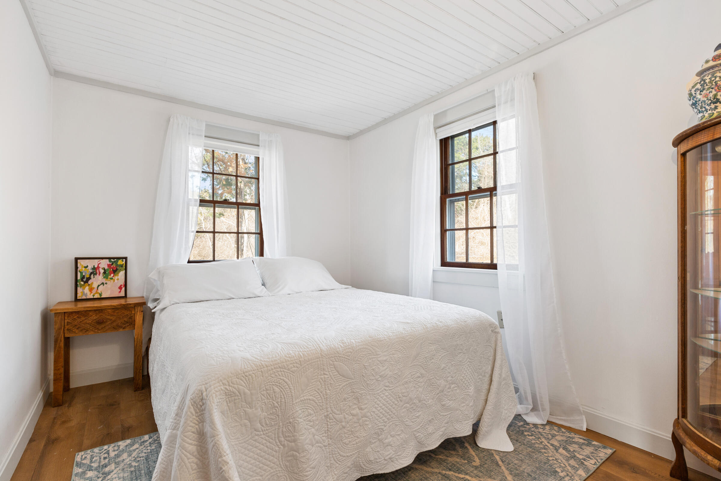 4 Perry Road Truro, MA 02666 - Photo 16 of 29 a bedroom with a bed and a window