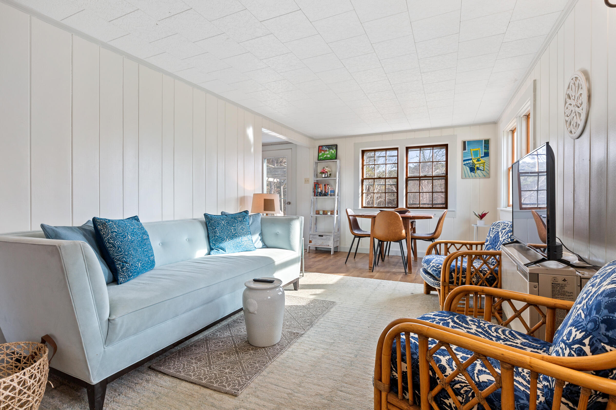 4 Perry Road Truro, MA 02666 - Photo 2 of 29 a living room with furniture and a flat screen tv