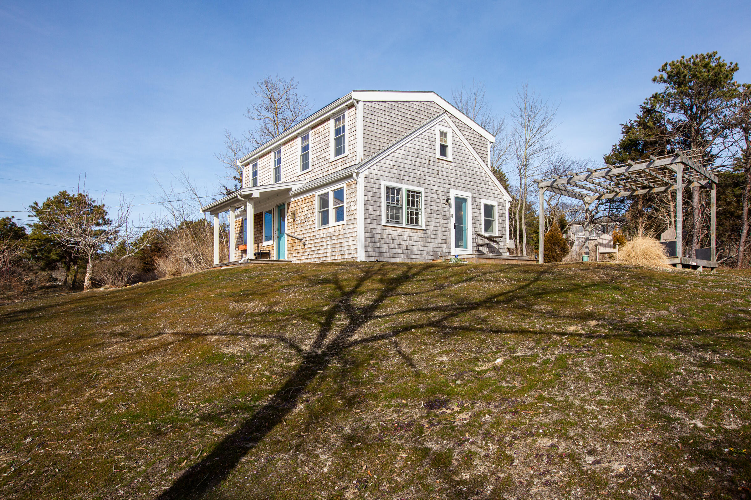 4 Perry Road Truro, MA 02666 - Photo 23 of 29 a front view of a house with a yard
