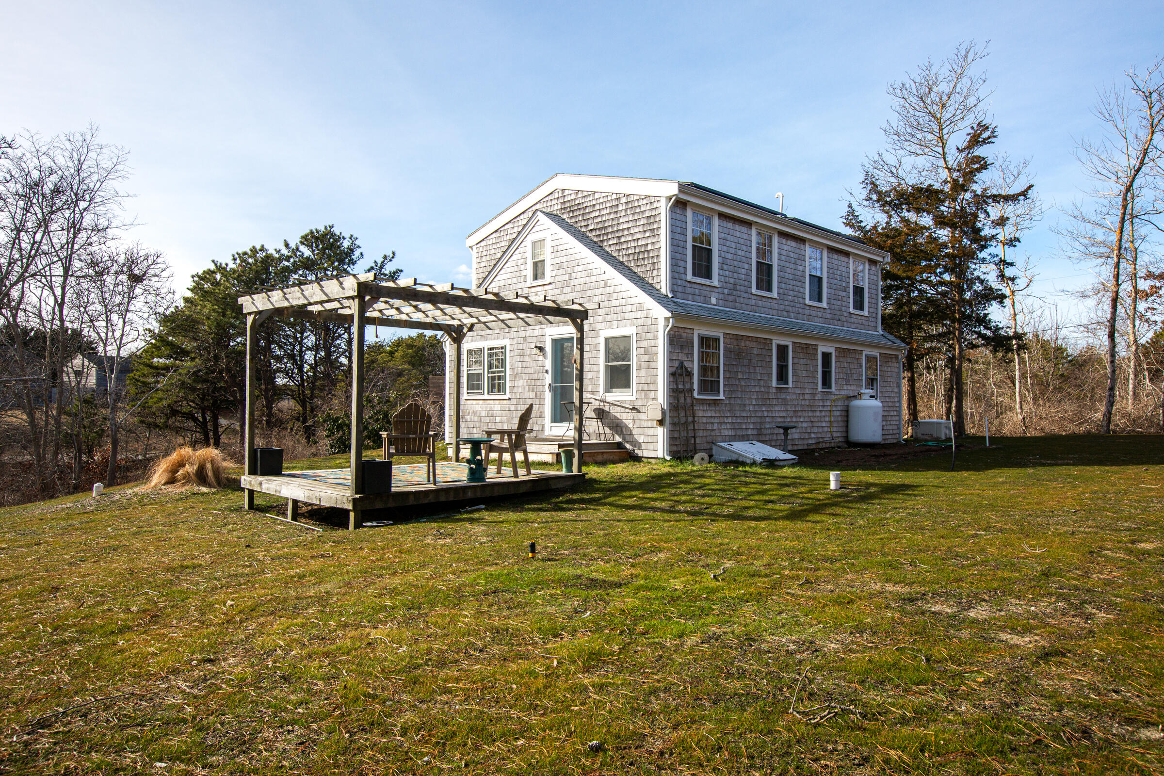 4 Perry Road Truro, MA 02666 - Photo 26 of 29 a view of a house with a yard and sitting area