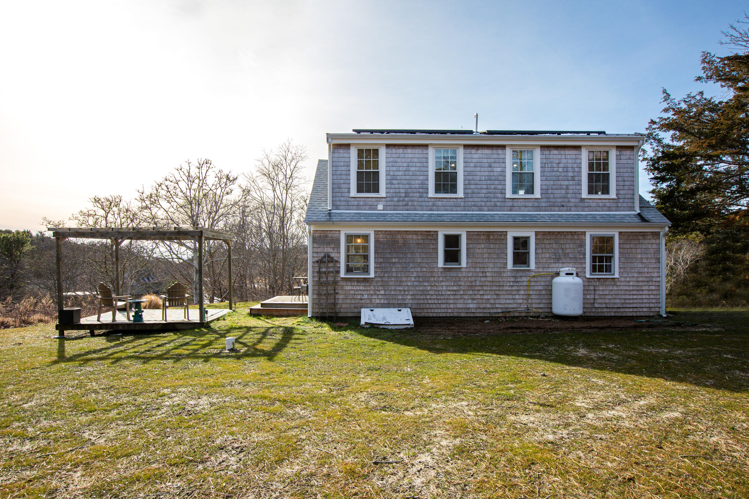 4 Perry Road Truro, MA 02666 - Photo 27 of 29 a view of a house with a backyard