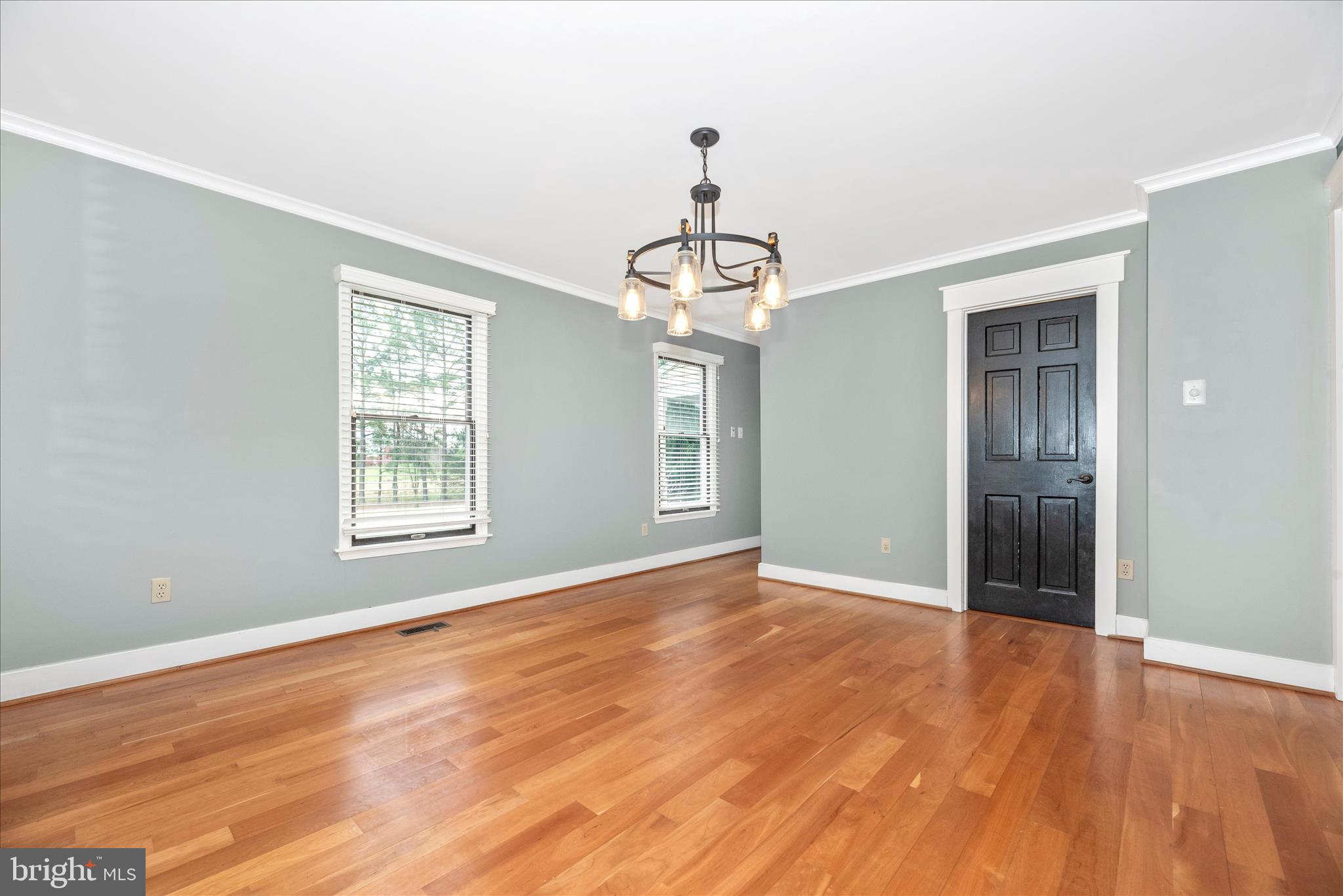 1150 Humbert Schoolhouse Road Westminster, MD 21158 - Photo 11 of 46 a view of an empty room with wooden floor and a window