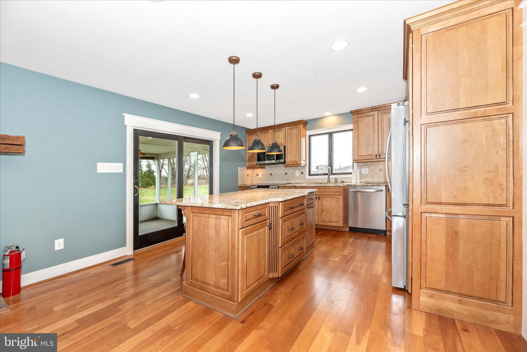 1150 Humbert Schoolhouse Road Westminster, MD 21158 - Photo 16 of 46 a kitchen with wooden floors and white appliances