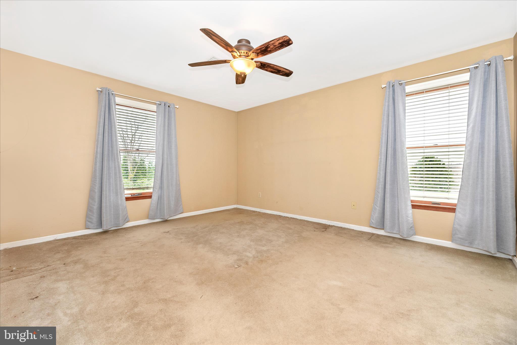 1150 Humbert Schoolhouse Road Westminster, MD 21158 - Photo 26 of 46 an empty room with ceiling fan and windows