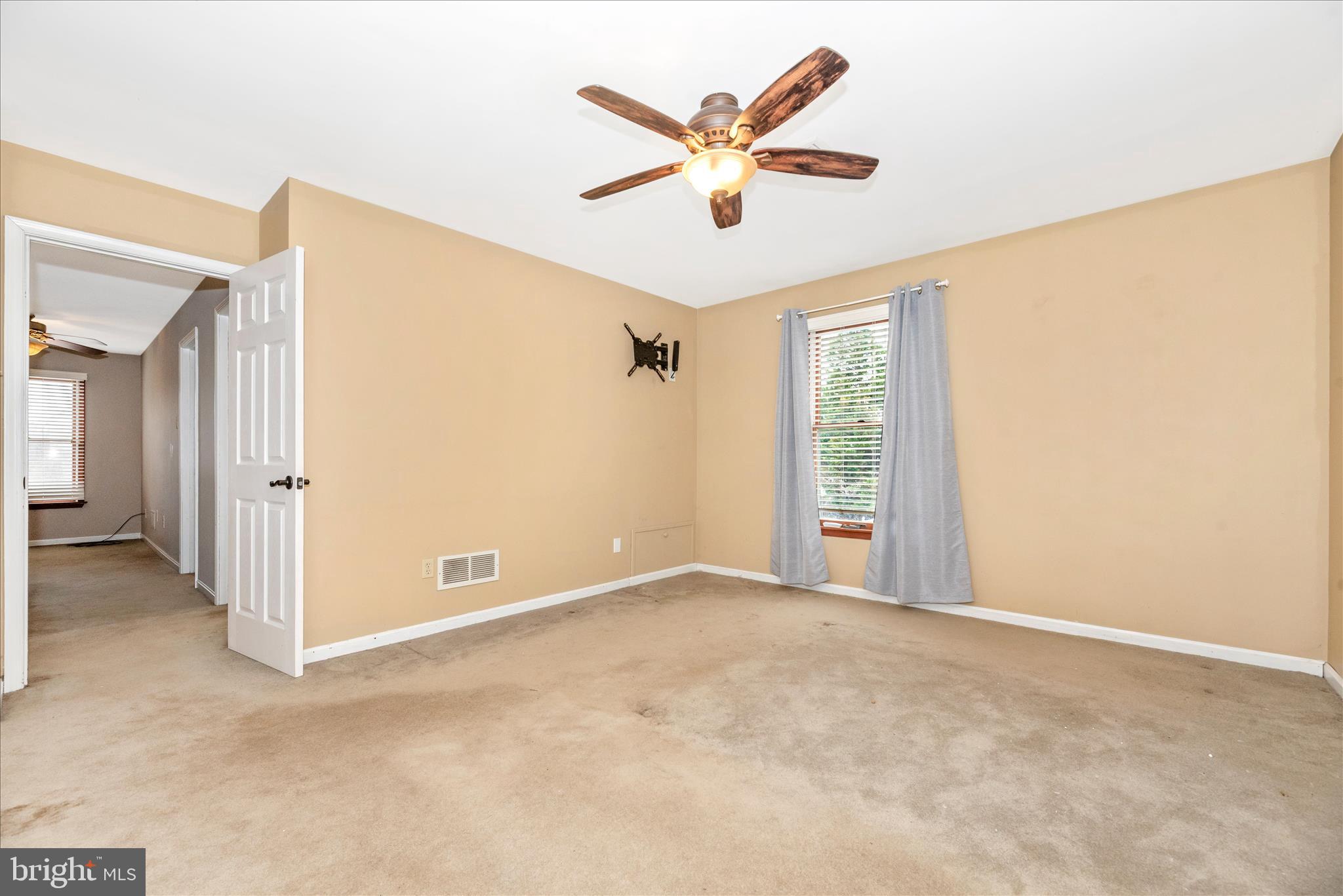 1150 Humbert Schoolhouse Road Westminster, MD 21158 - Photo 27 of 46 an empty room with ceiling fan and windows