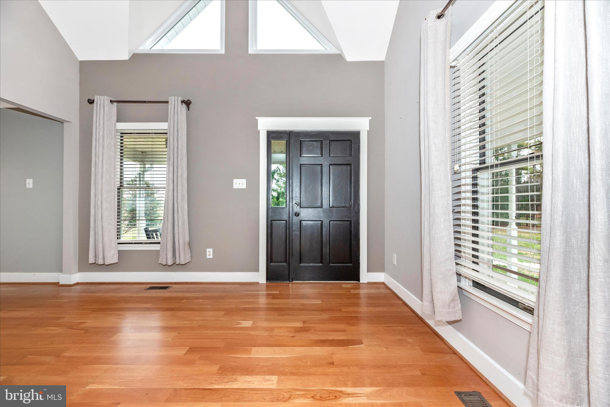1150 Humbert Schoolhouse Road Westminster, MD 21158 - Photo 7 of 46 a view of a room with wooden floor and a floor to ceiling window