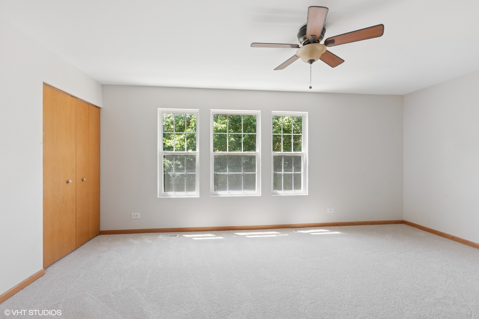 133 Springbrook Trail South Oswego, IL 60543 - Photo 13 of 29 an empty room with a window and a fan