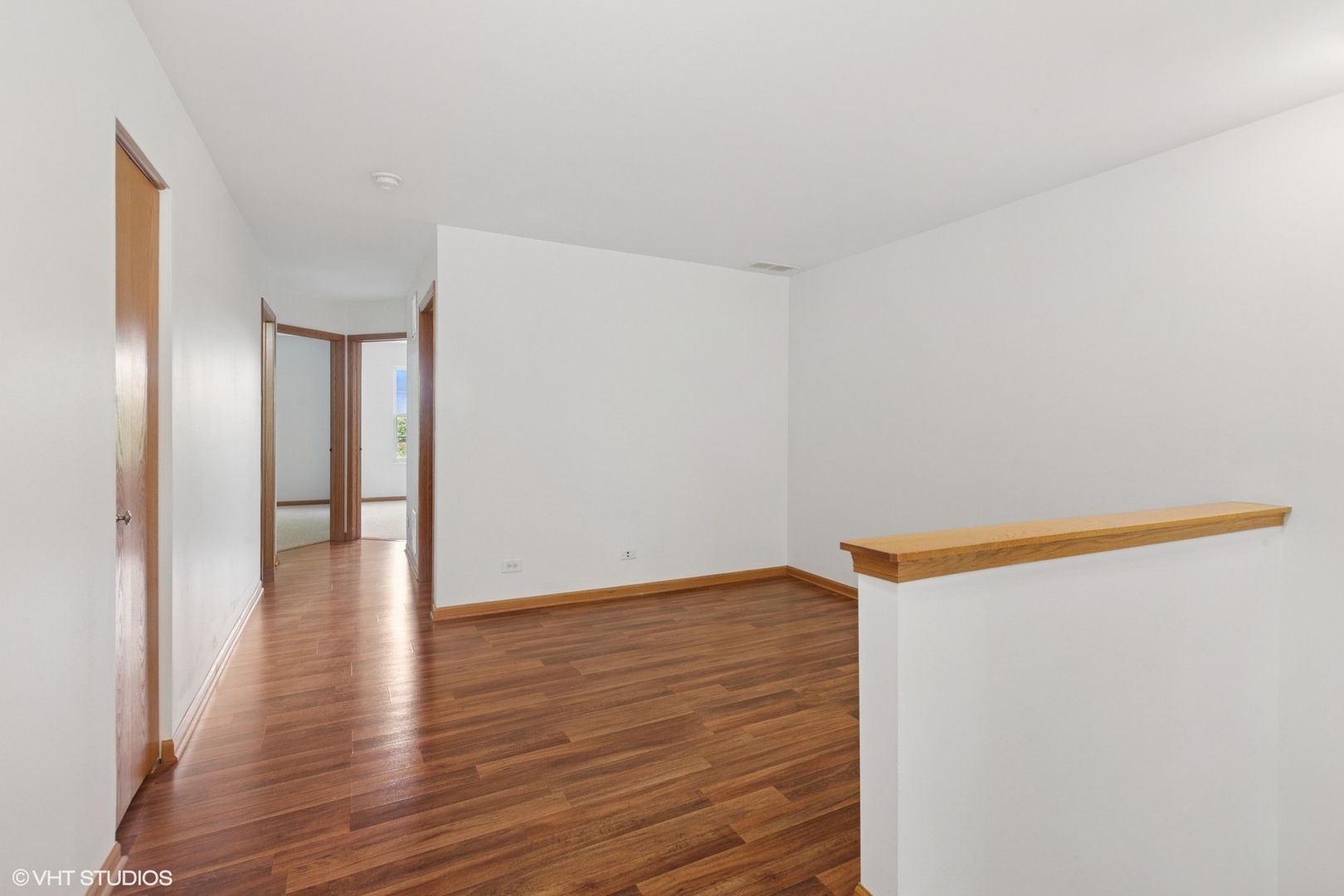 133 Springbrook Trail South Oswego, IL 60543 - Photo 18 of 29 a view of an empty room with wooden floor