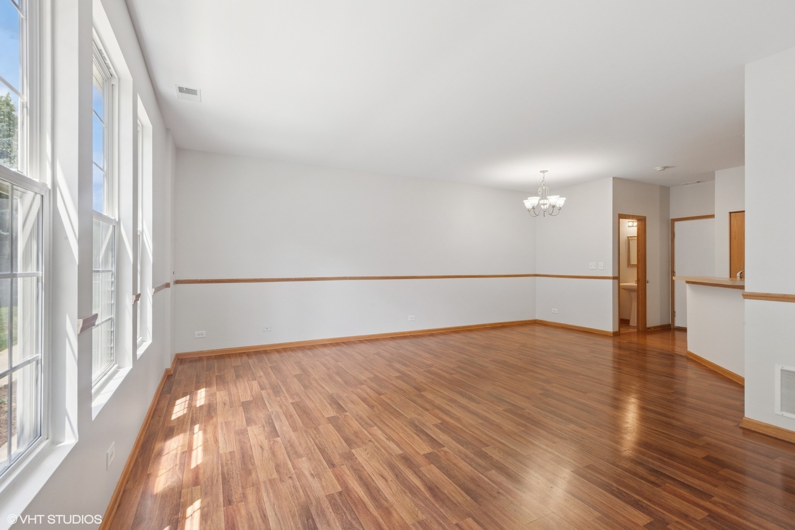 133 Springbrook Trail South Oswego, IL 60543 - Photo 3 of 29 a view of empty room with wooden floor and fan