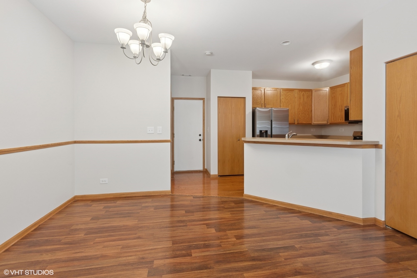 133 Springbrook Trail South Oswego, IL 60543 - Photo 6 of 29 a view of a kitchen with a dishwasher cabinets and wooden floor