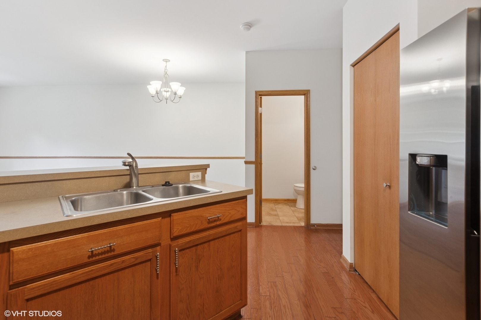 133 Springbrook Trail South Oswego, IL 60543 - Photo 9 of 29 a view of a kitchen from a hallway
