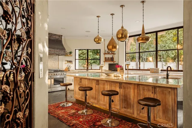 a dining hall with a large window and chairs