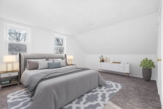 a bedroom with a bed and a couch