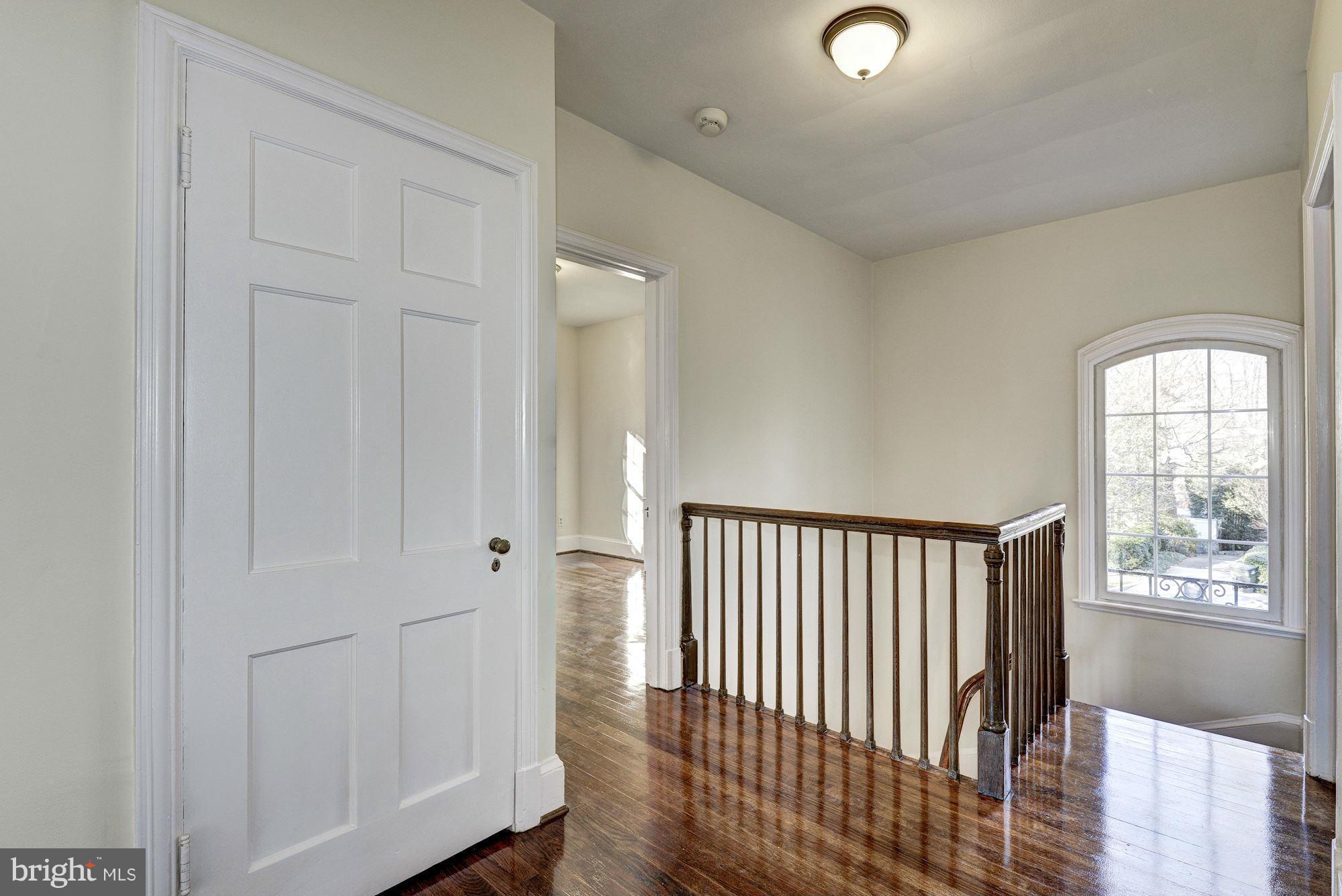 4910 Hillbrook Lane Northwest Washington, DC 20016 - Photo 13 of 30 a view of a hallway with windows and stairs