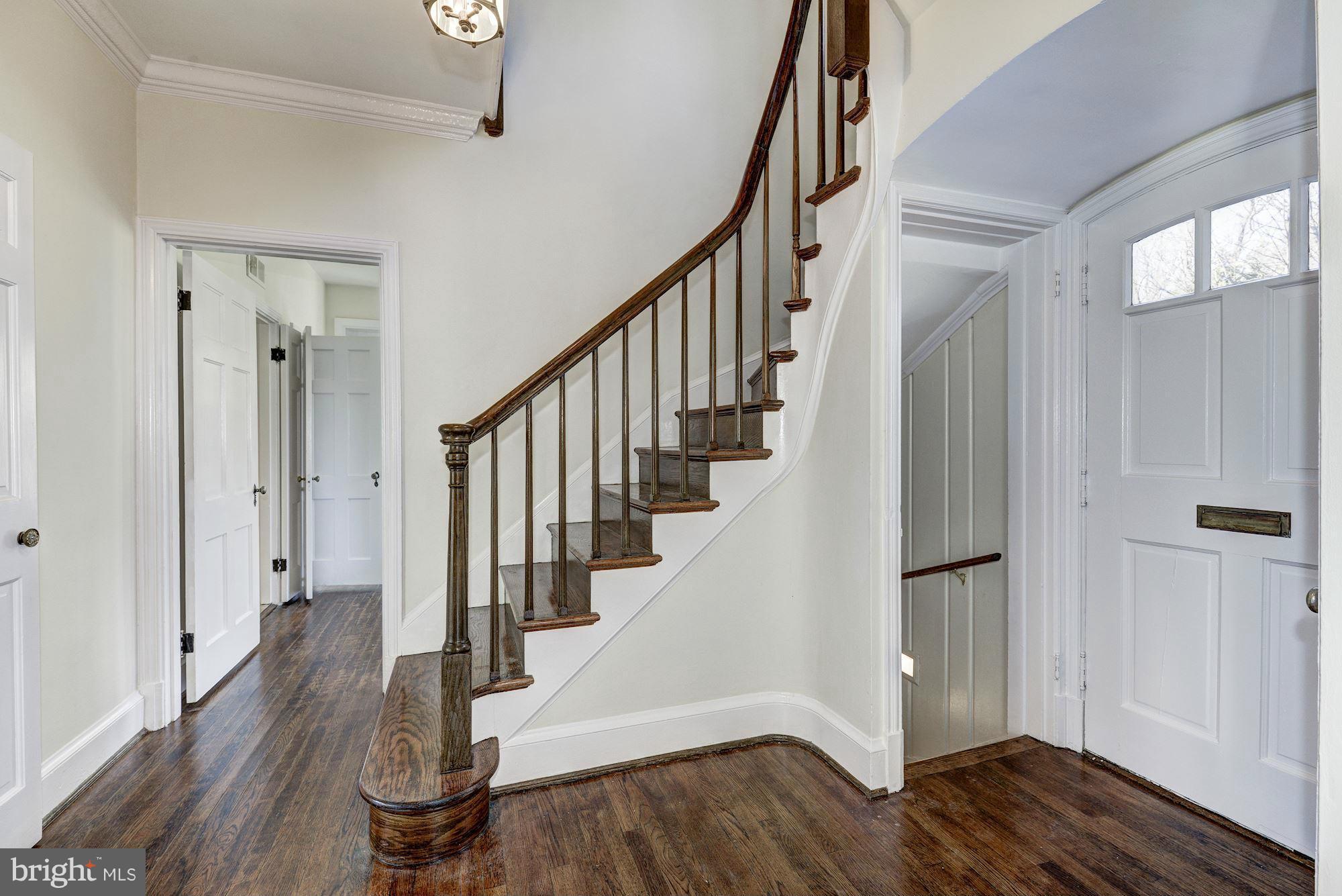 4910 Hillbrook Lane Northwest Washington, DC 20016 - Photo 3 of 30 a view of entryway with wooden floor and stairs