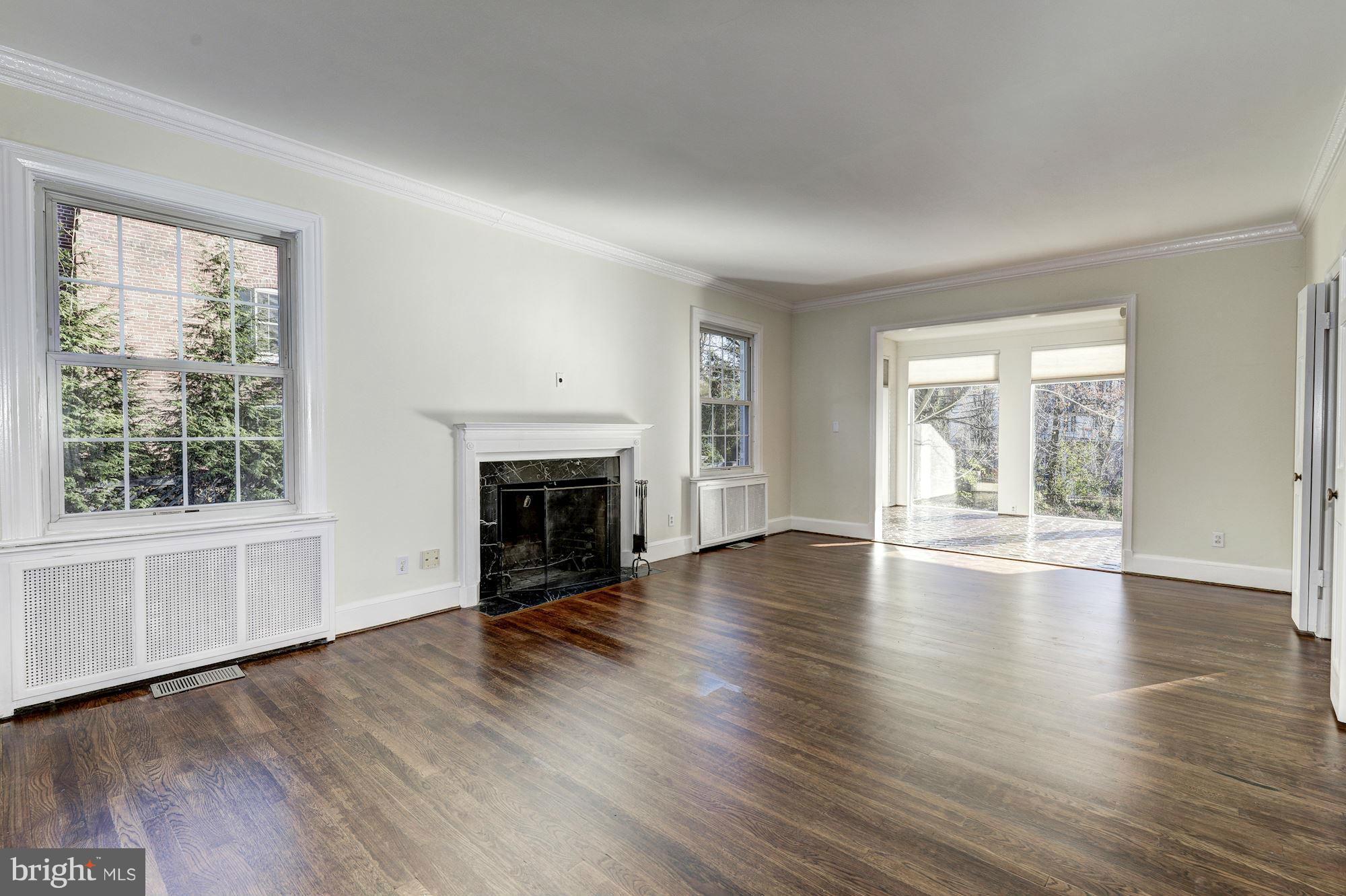 4910 Hillbrook Lane Northwest Washington, DC 20016 - Photo 5 of 30 wooden floor fireplace and natural light in room