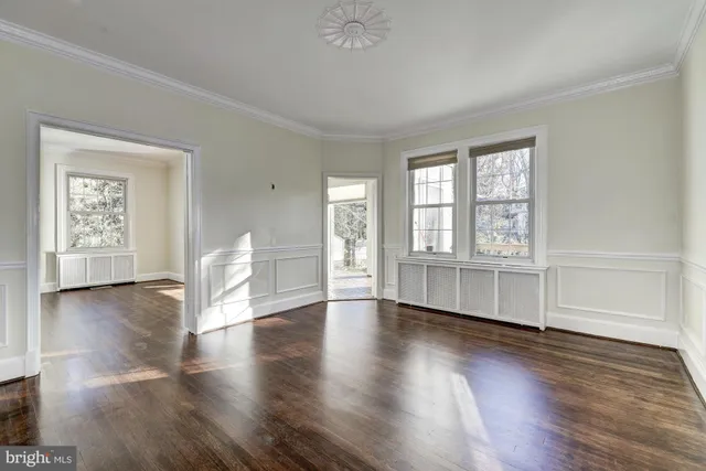 a kitchen with kitchen island granite countertop a refrigerator stove top oven and sink